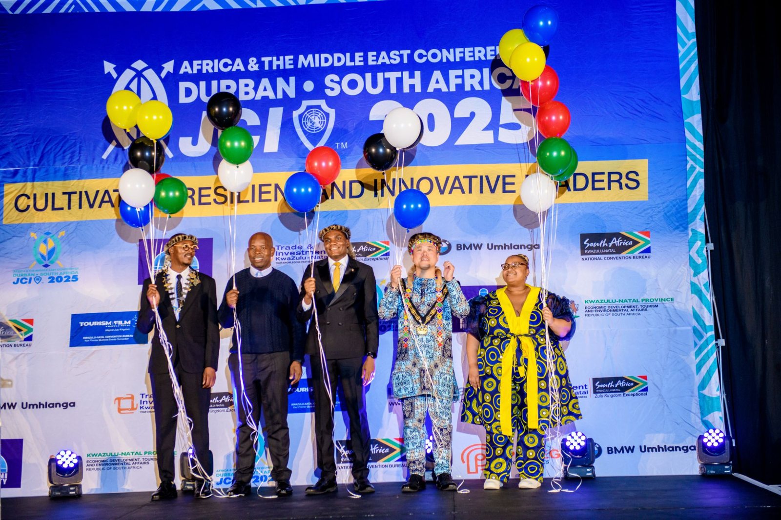 Leaders on stage releasing balloons at the JCI Africa and the Middle East Conference, Durban 2025
