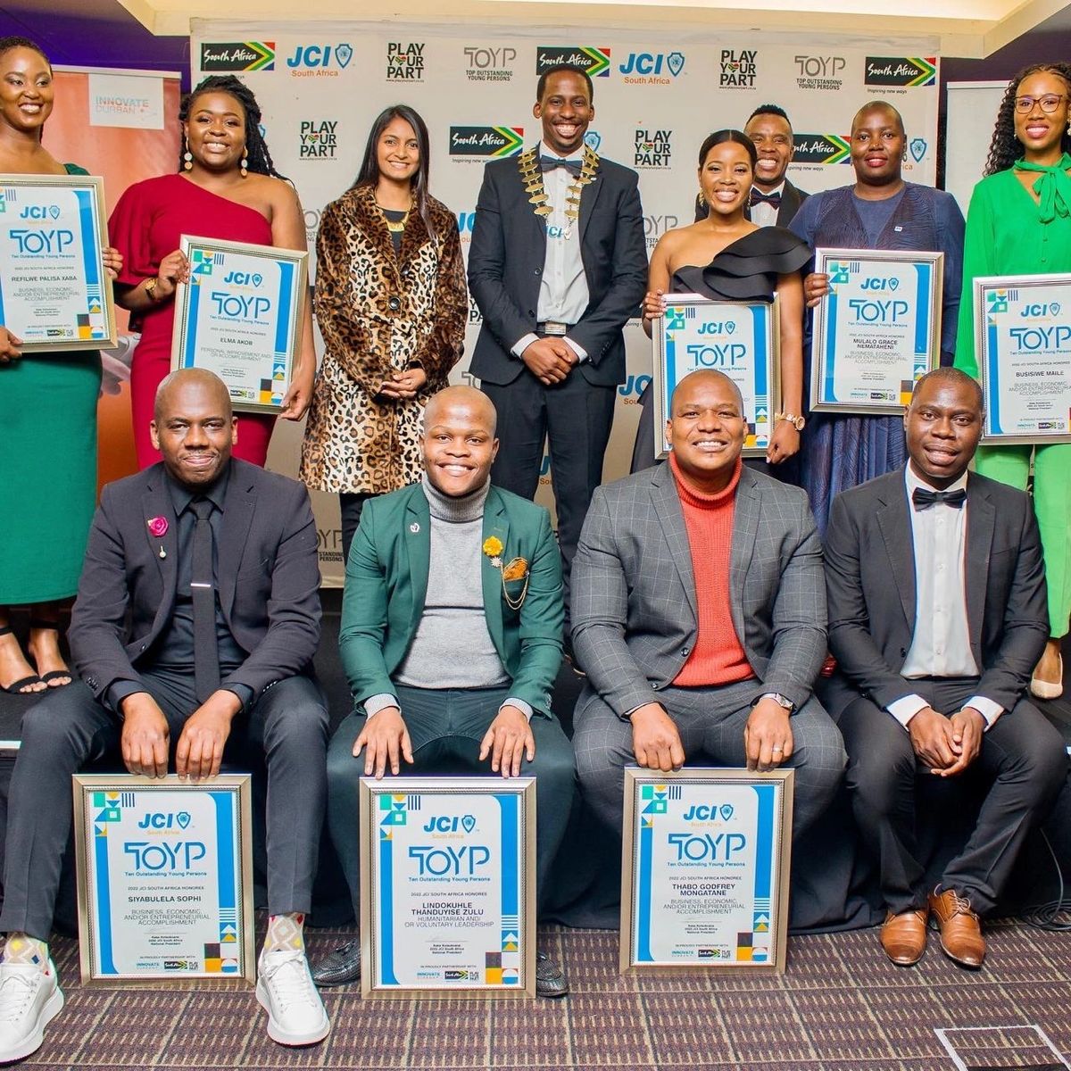 TOYP honorees holding their award certificates